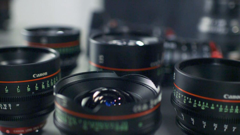 Camera lenses on a table top.